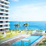 Beachfront Bliss Apt, With Heated Pool, By Oyoostays Apartment